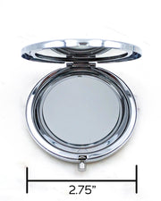 Opened silver compact mirror