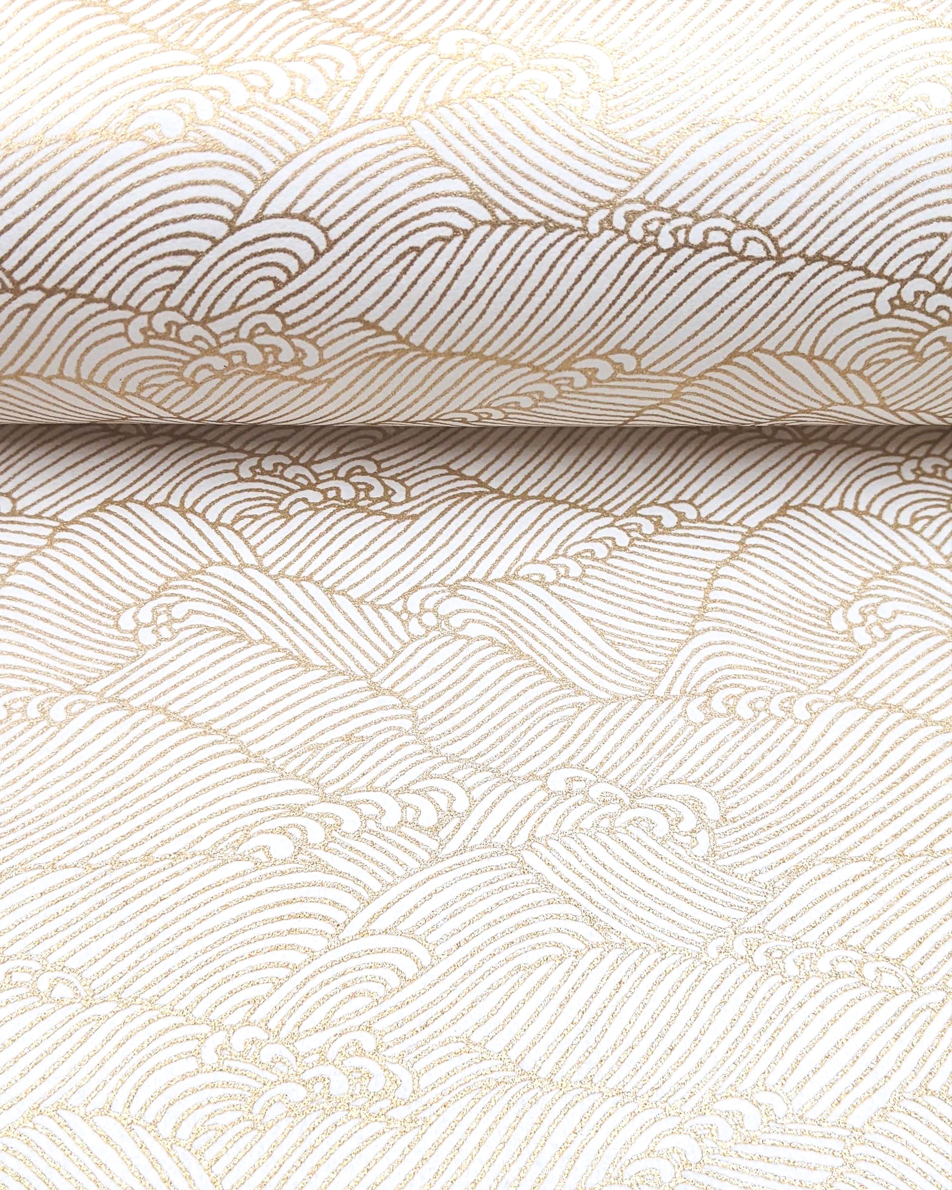 Japanese chiyogami featuring small metallic gold waves on a white background.