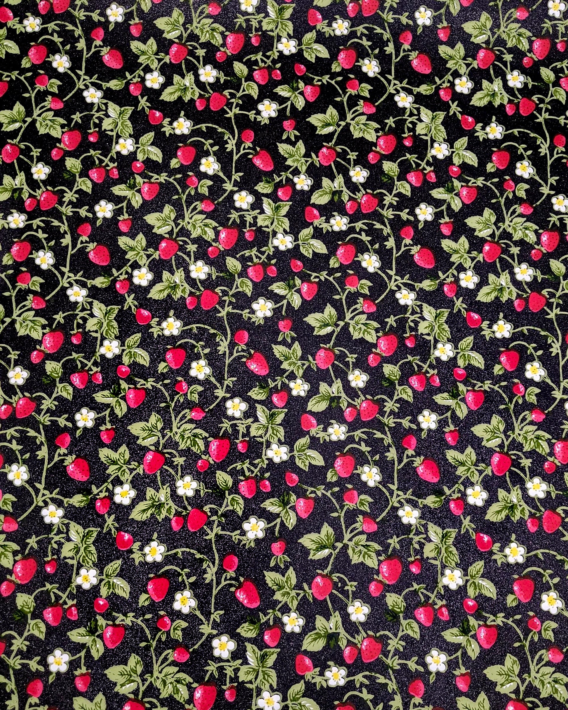Japanese chiyogami paper featuring red strawberries with green leaves and white flowers on a glittery black background.