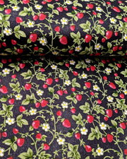 Japanese chiyogami paper featuring red strawberries with green leaves and white flowers on a glittery black background.