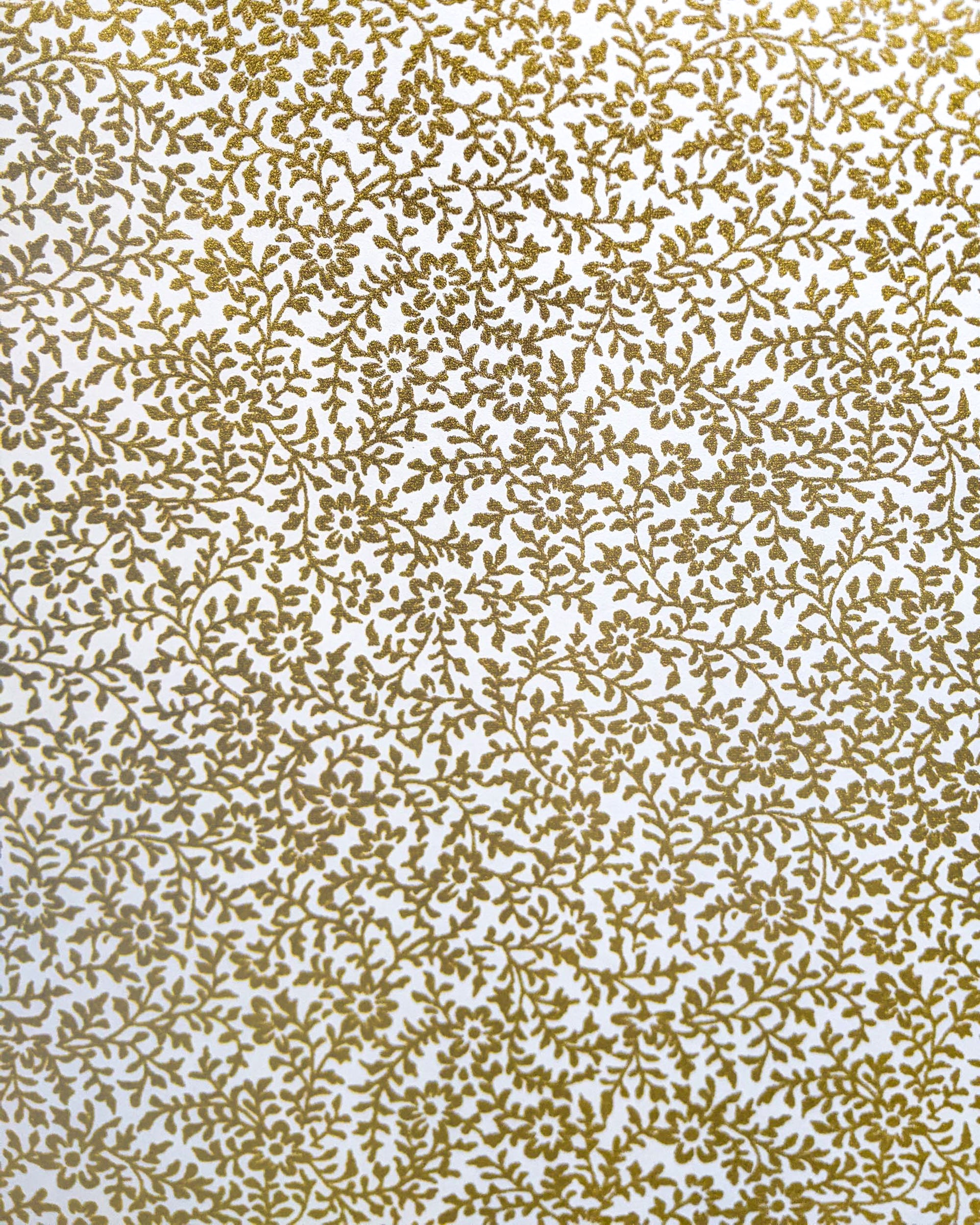 Japanese chiyogami featuring a metallic gold floral design on a white background.