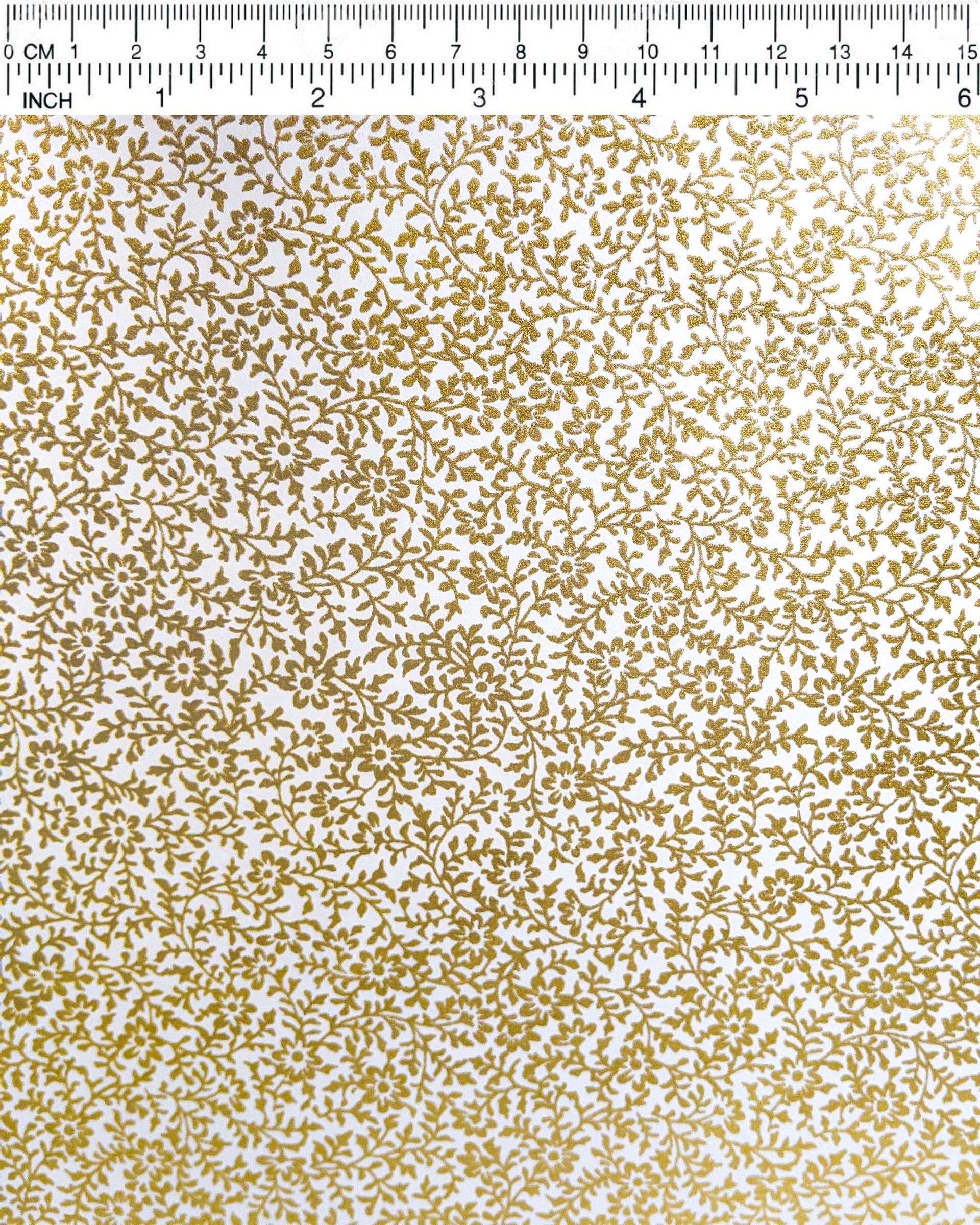 Japanese chiyogami featuring a metallic gold floral design on a white background.