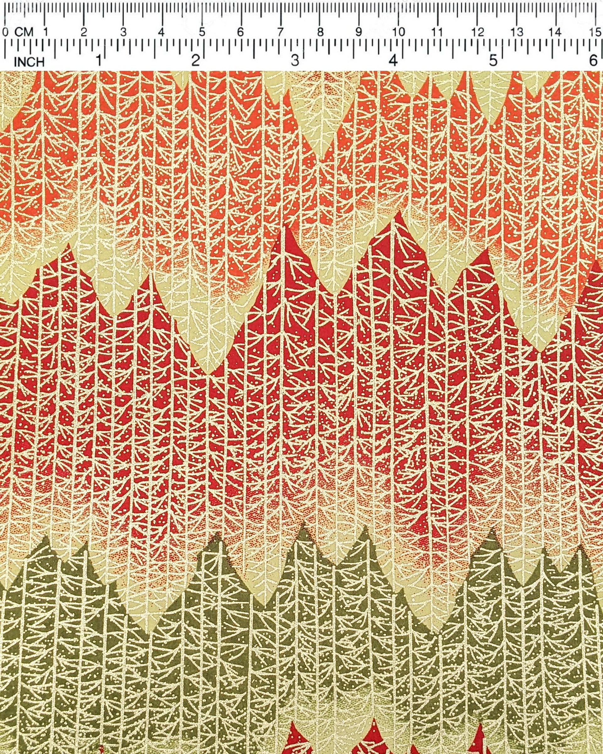 Japanese chiyogami paper featuring a orange, yellow, and green forest with metallic gold trees.