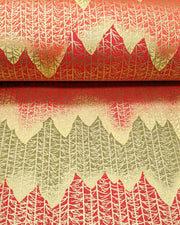 Japanese chiyogami paper featuring a orange, yellow, and green forest with metallic gold trees.
