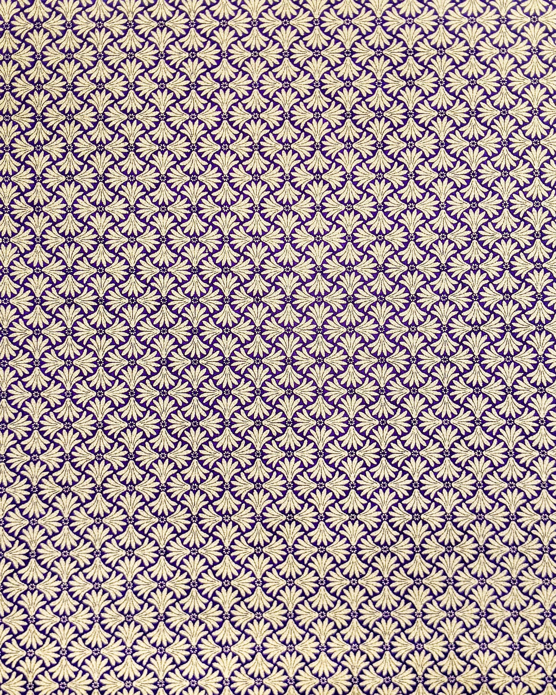 Japanese chiyogami paper featuring a metallic gold geometric pattern on a purple background.
