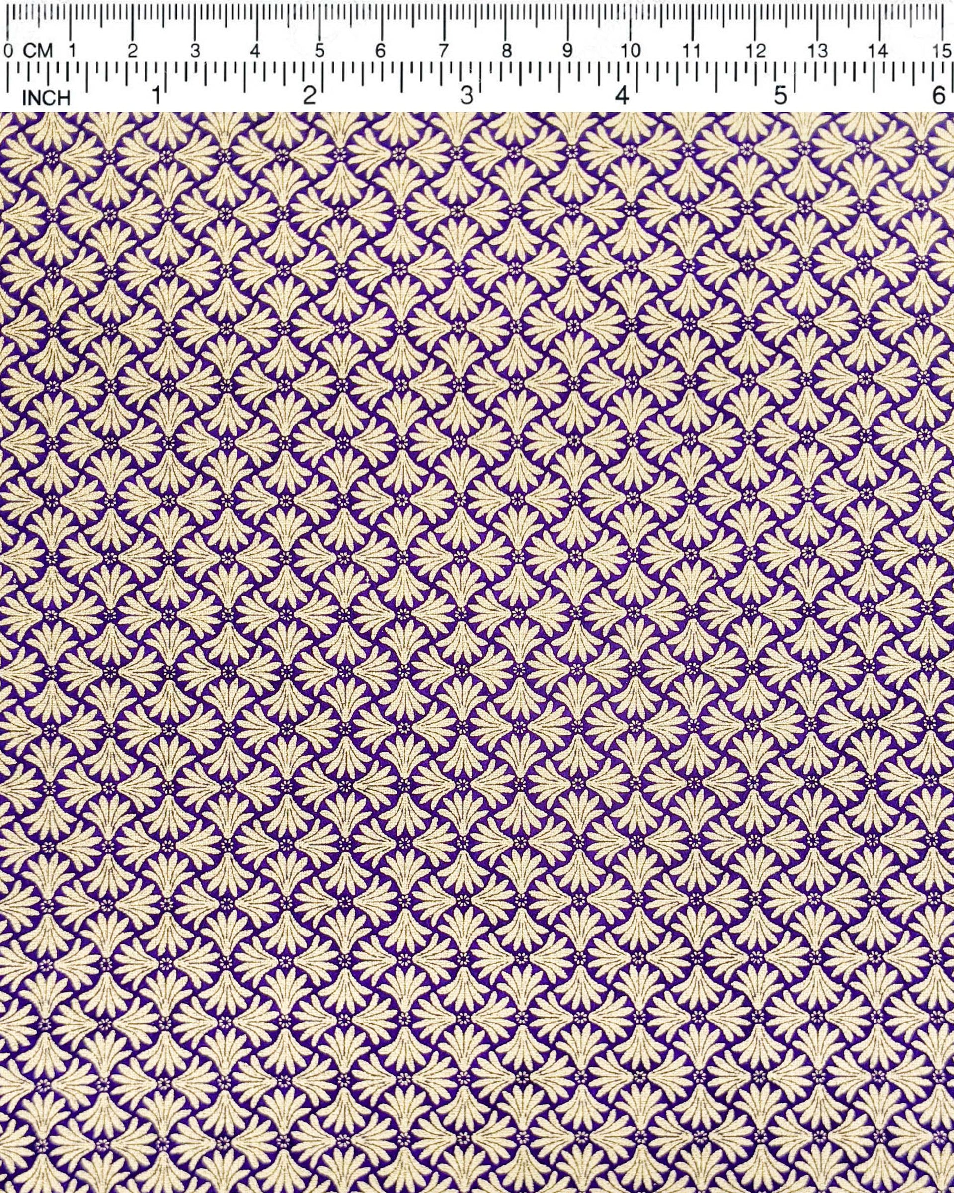 Japanese chiyogami paper featuring a metallic gold geometric pattern on a purple background.