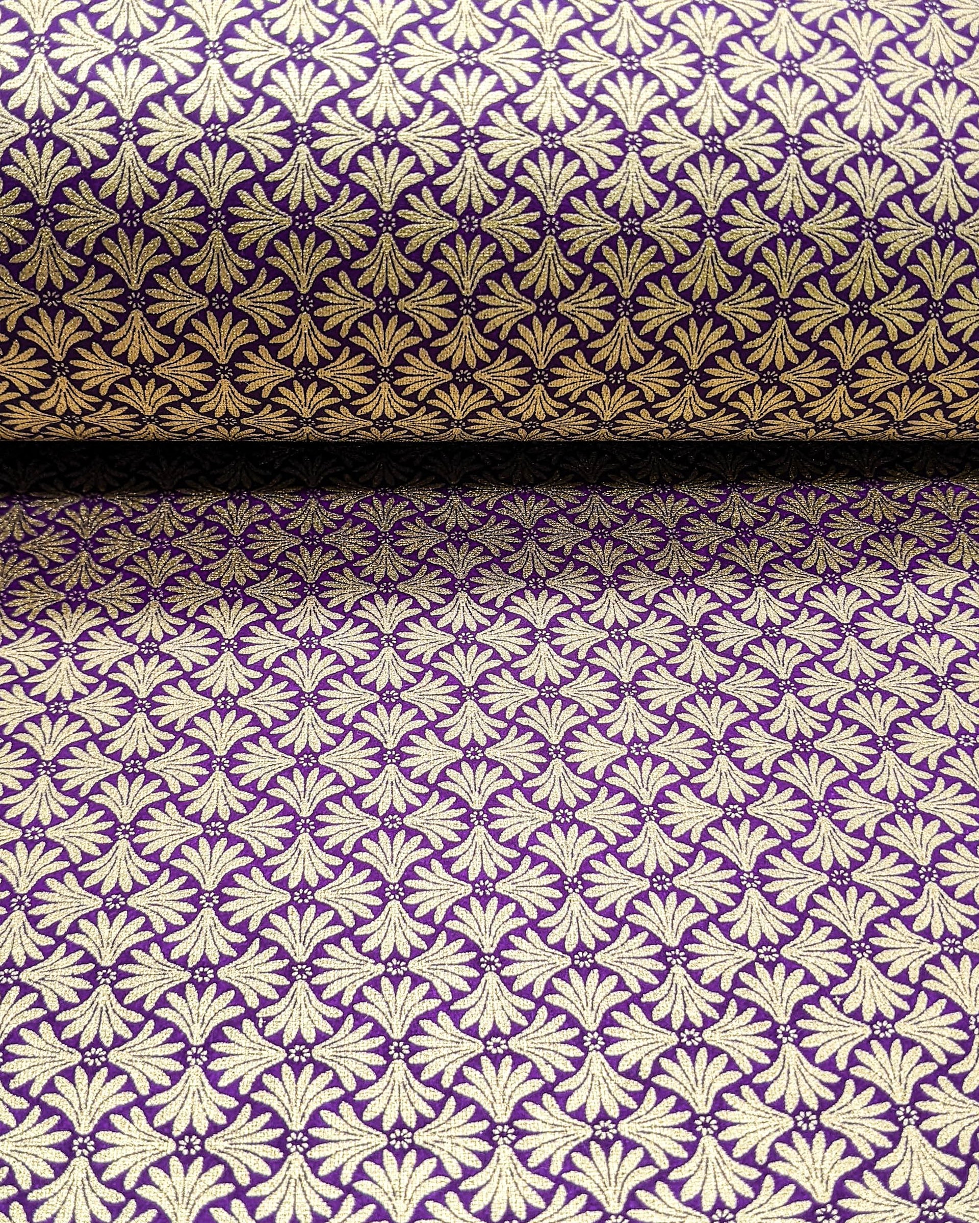 Japanese chiyogami paper featuring a metallic gold geometric pattern on a purple background.