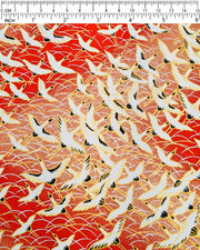 Japanese chiyogami featuring flying white cranes zigzagging on a gold & red background with metallic gold accents.