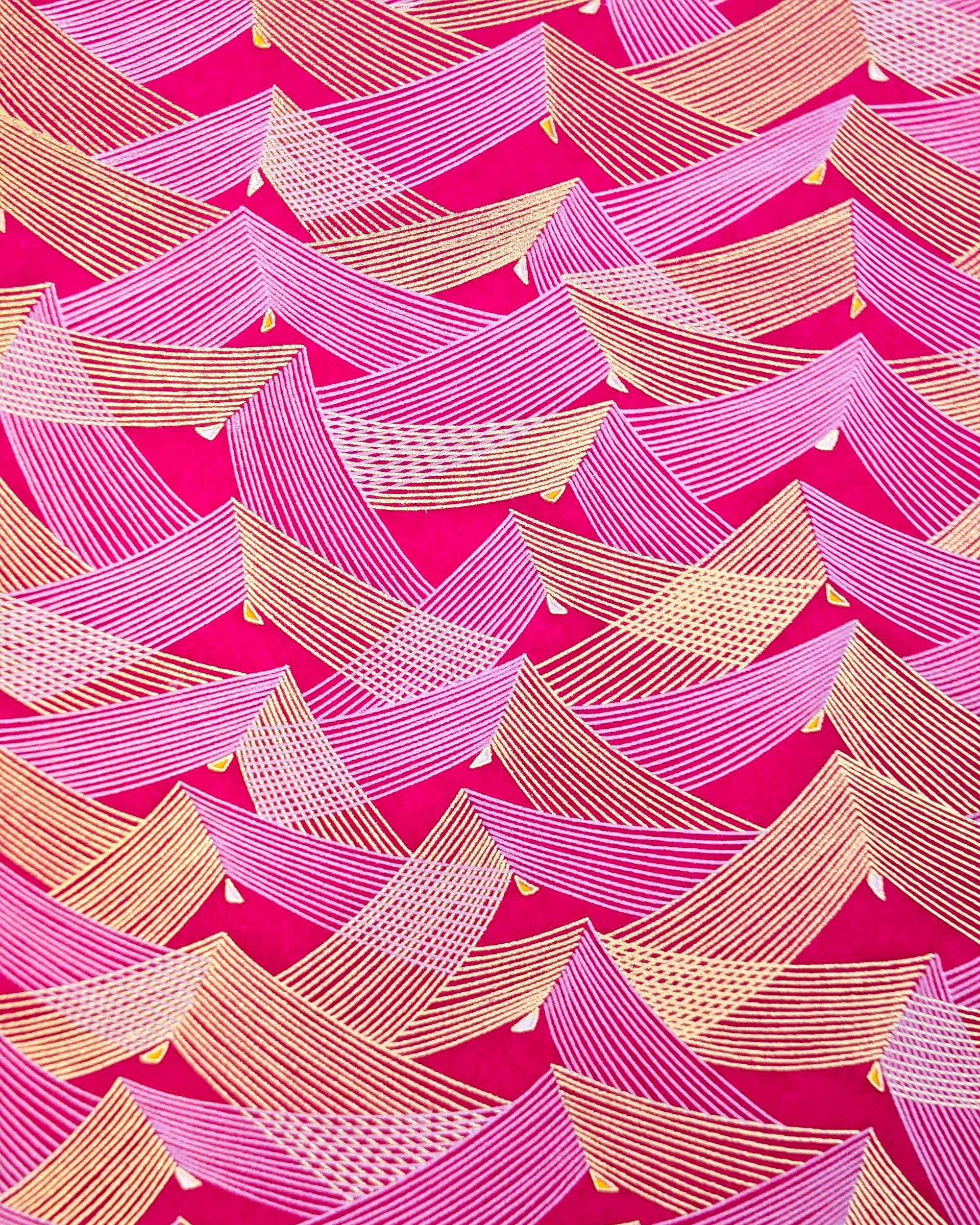 Japanese chiyogami paper featuring metallic gold & white triangles on a magenta pink background.
