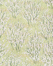Japanese chiyogami paper featuring small white flower bushes over a yellow green background with metallic gold accents.