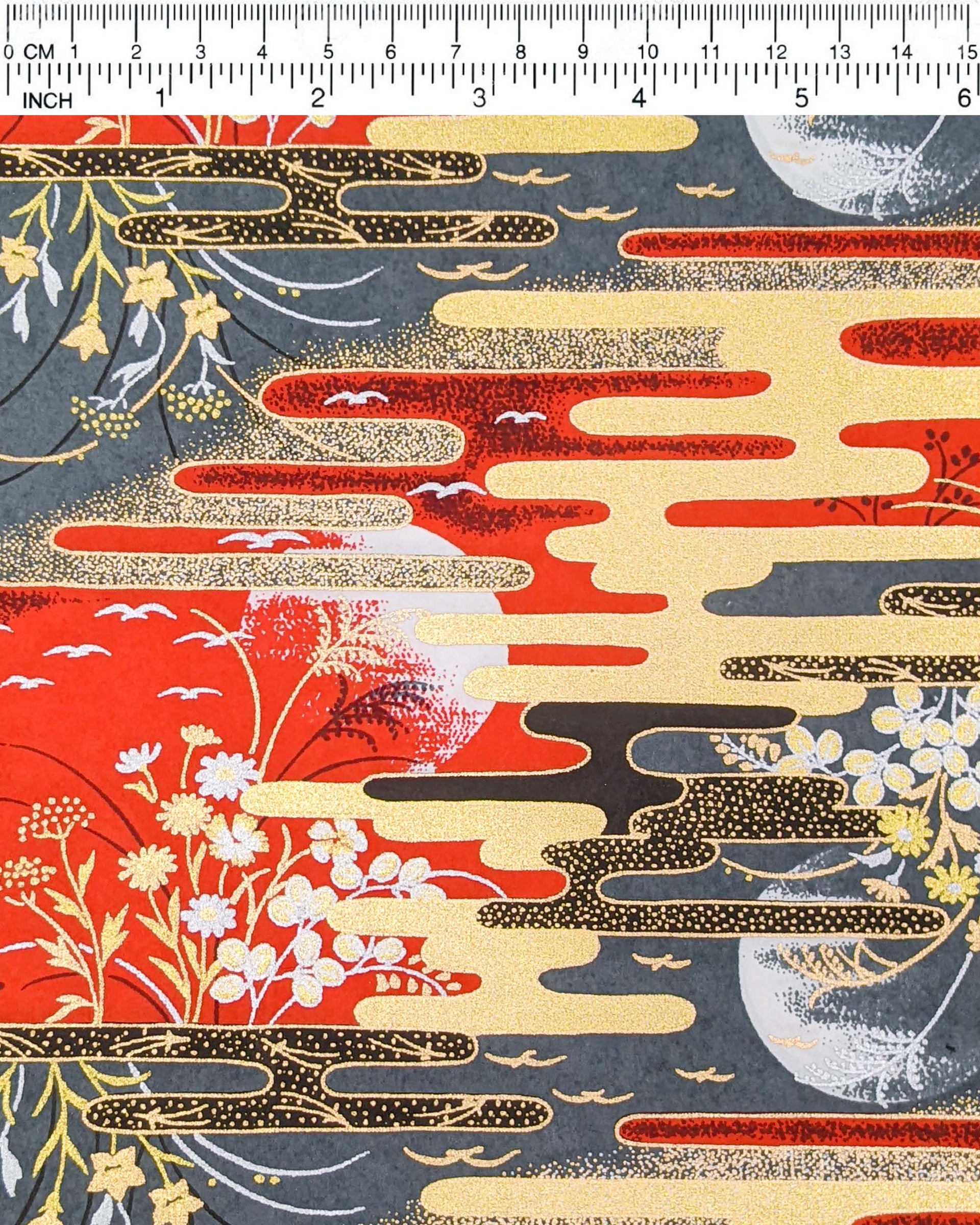 Japanese chiyogami paper featuring full moons, flowers, and flying birds on a red and gray background with metallic silver and gold accents.
