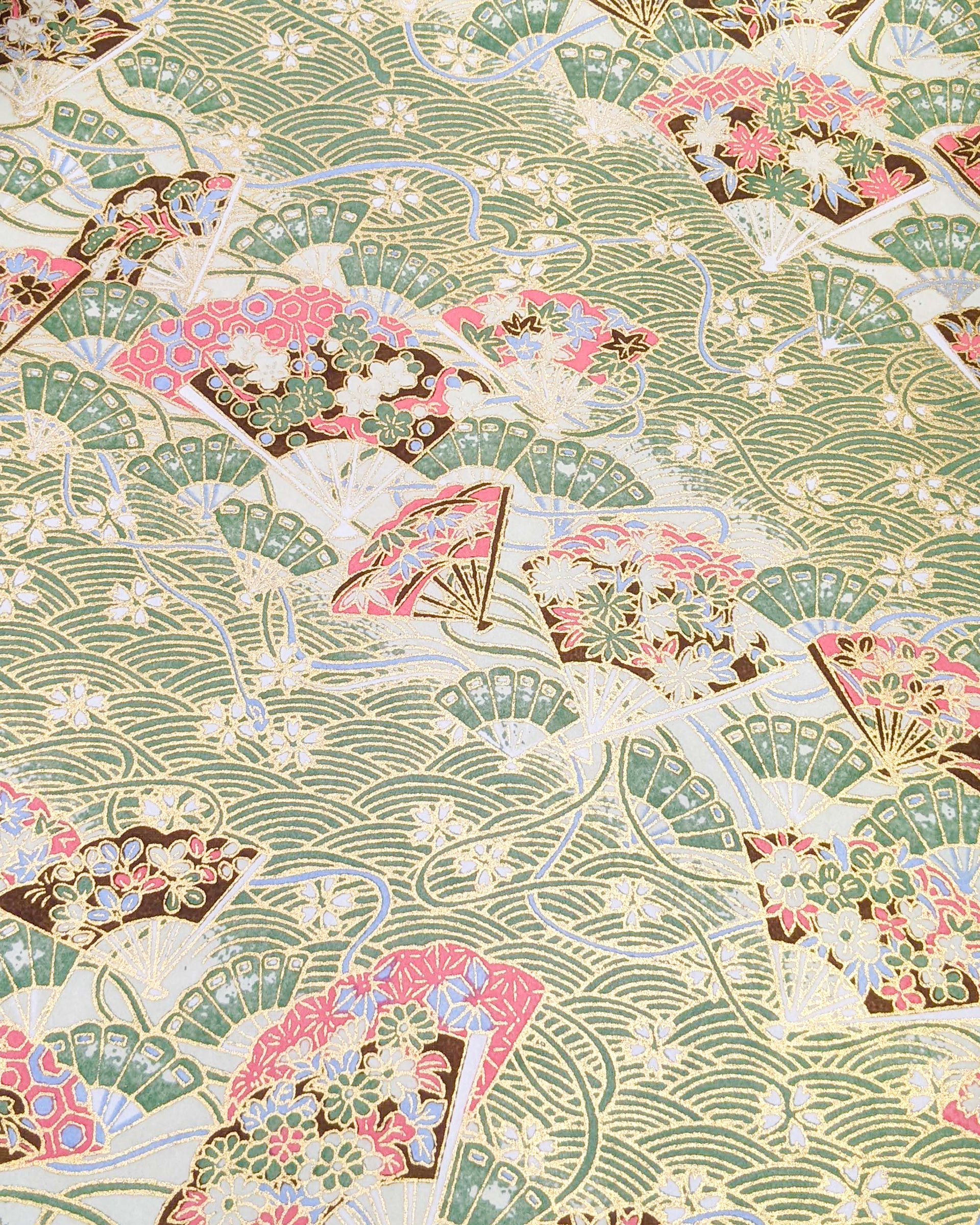 Japanese chiyogami featuring floral hand fans on a green wave crest background with metallic gold accents.