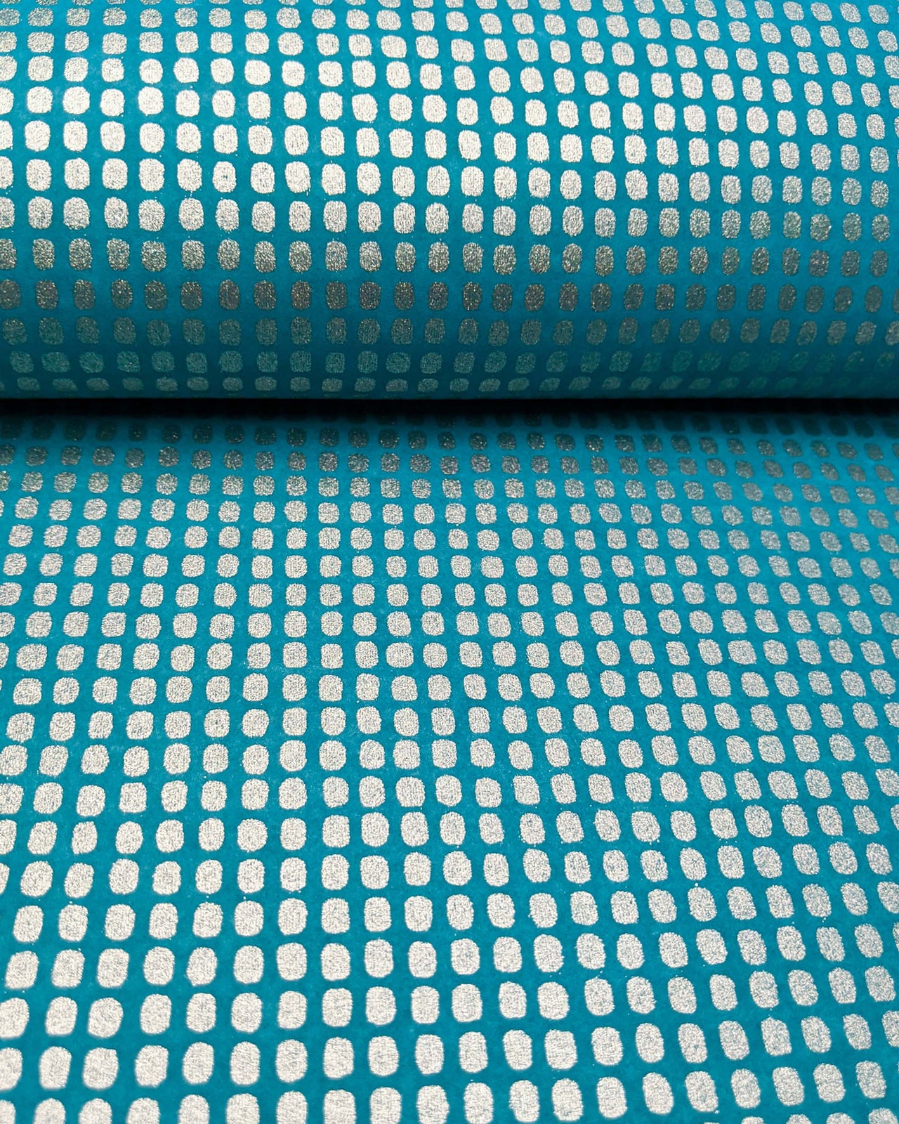 Japanese chiyogami paper featuring metallic silver geometric blocks on a blue background.