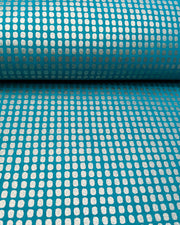 Japanese chiyogami paper featuring metallic silver geometric blocks on a blue background.
