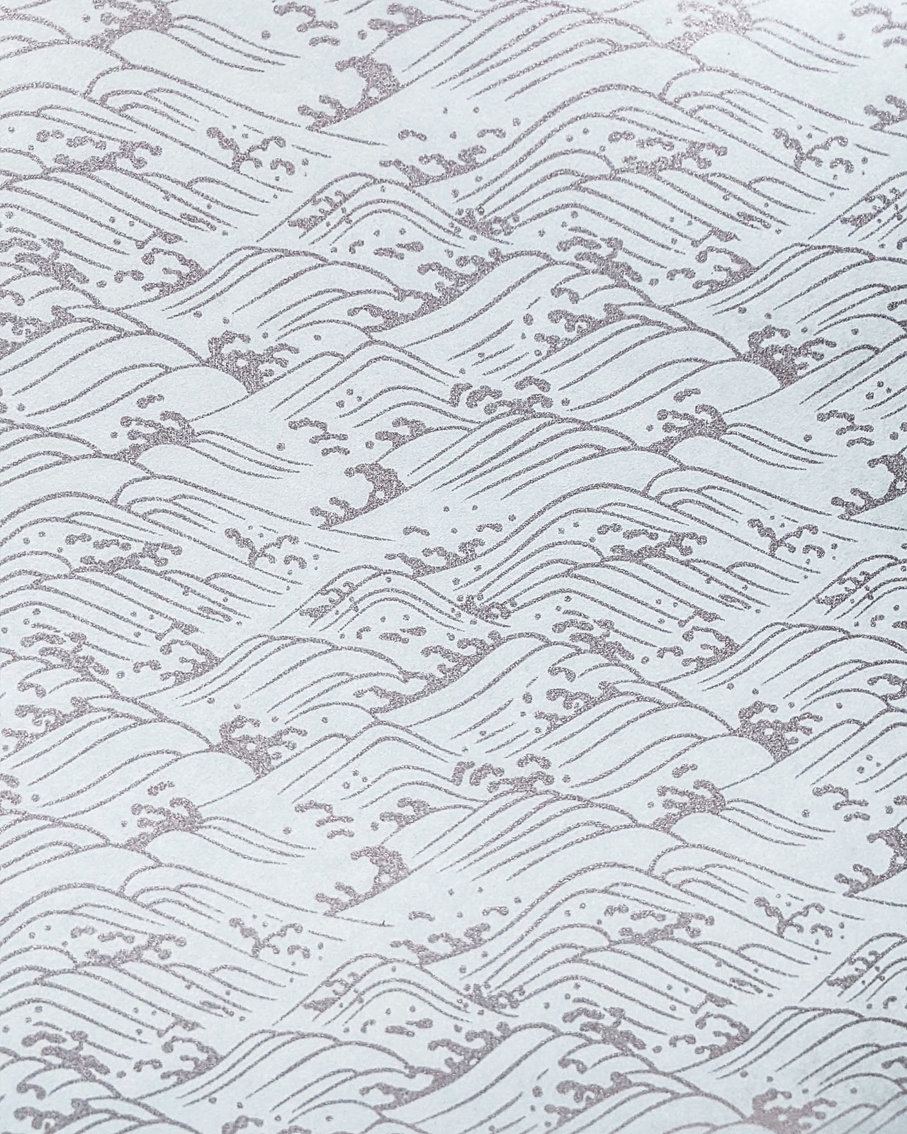 Japanese chiyogami paper featuring metallic silver waves on a light blue background.