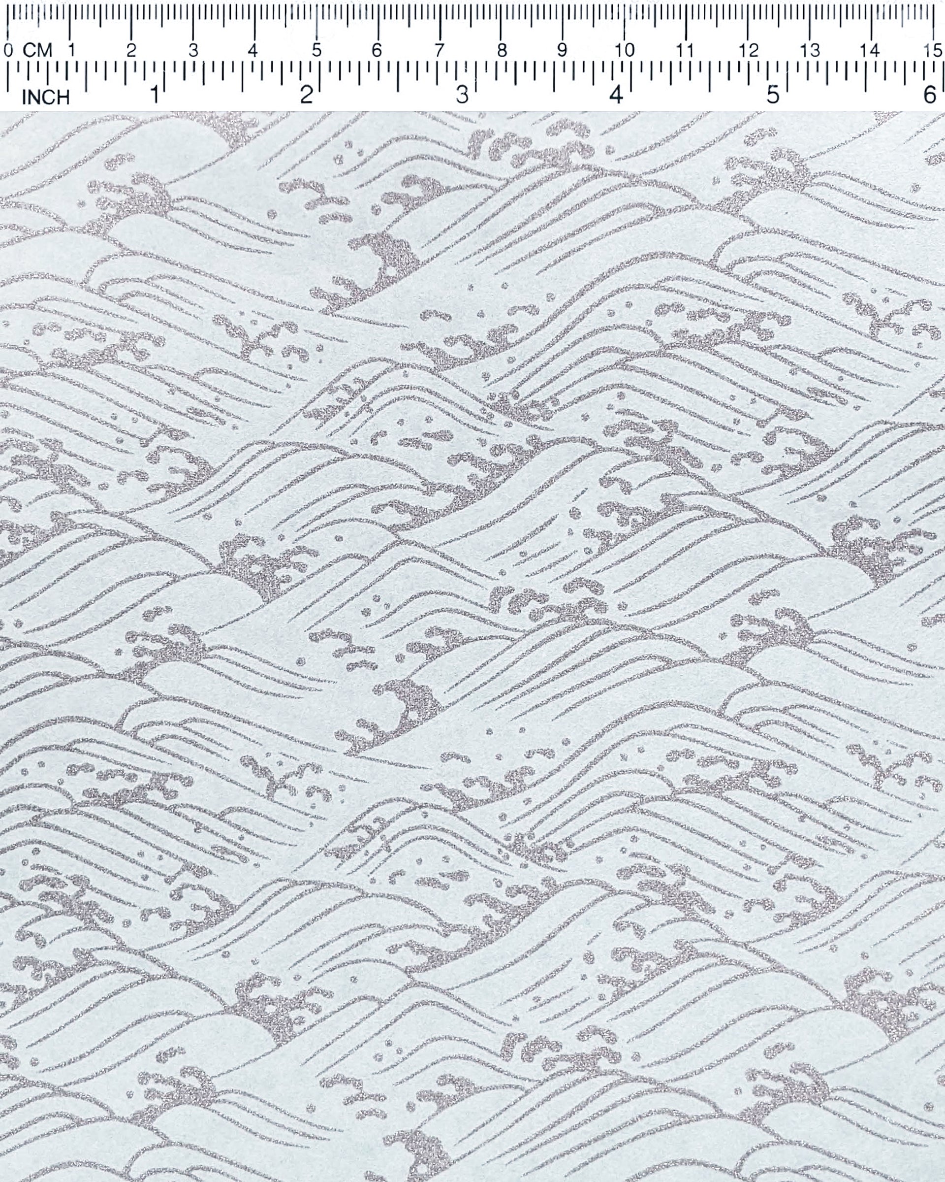Japanese chiyogami paper featuring metallic silver waves on a light blue background.