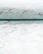 Japanese chiyogami paper featuring metallic silver waves on a light blue background.
