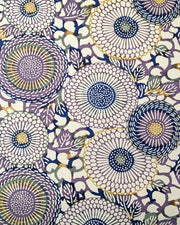 Japanese chiyogami paper featuring large purple & yellow zinnia flowers on a beige background.