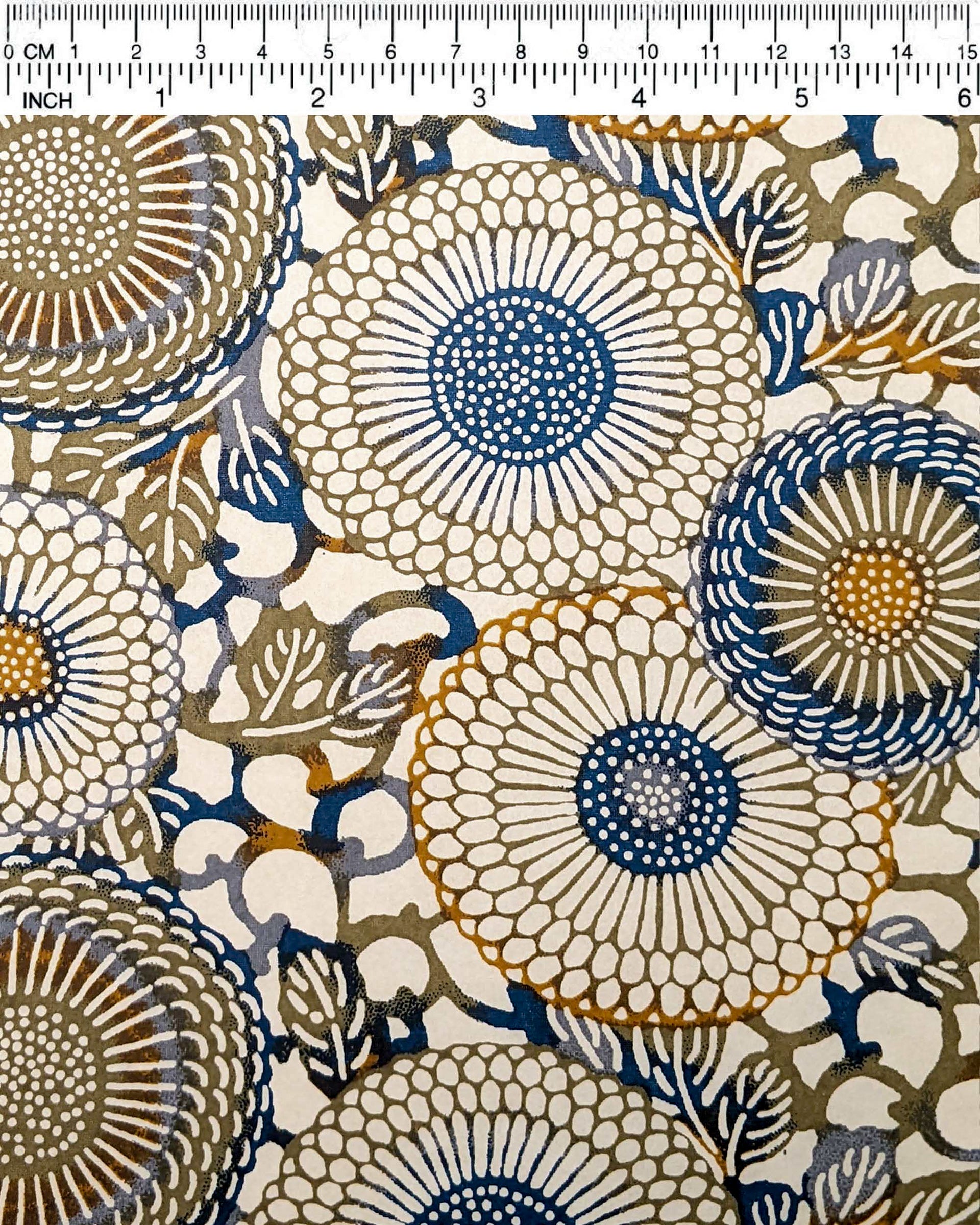 Japanese chiyogami paper featuring large blue and green zinnia flowers with orange accents on a beige background.