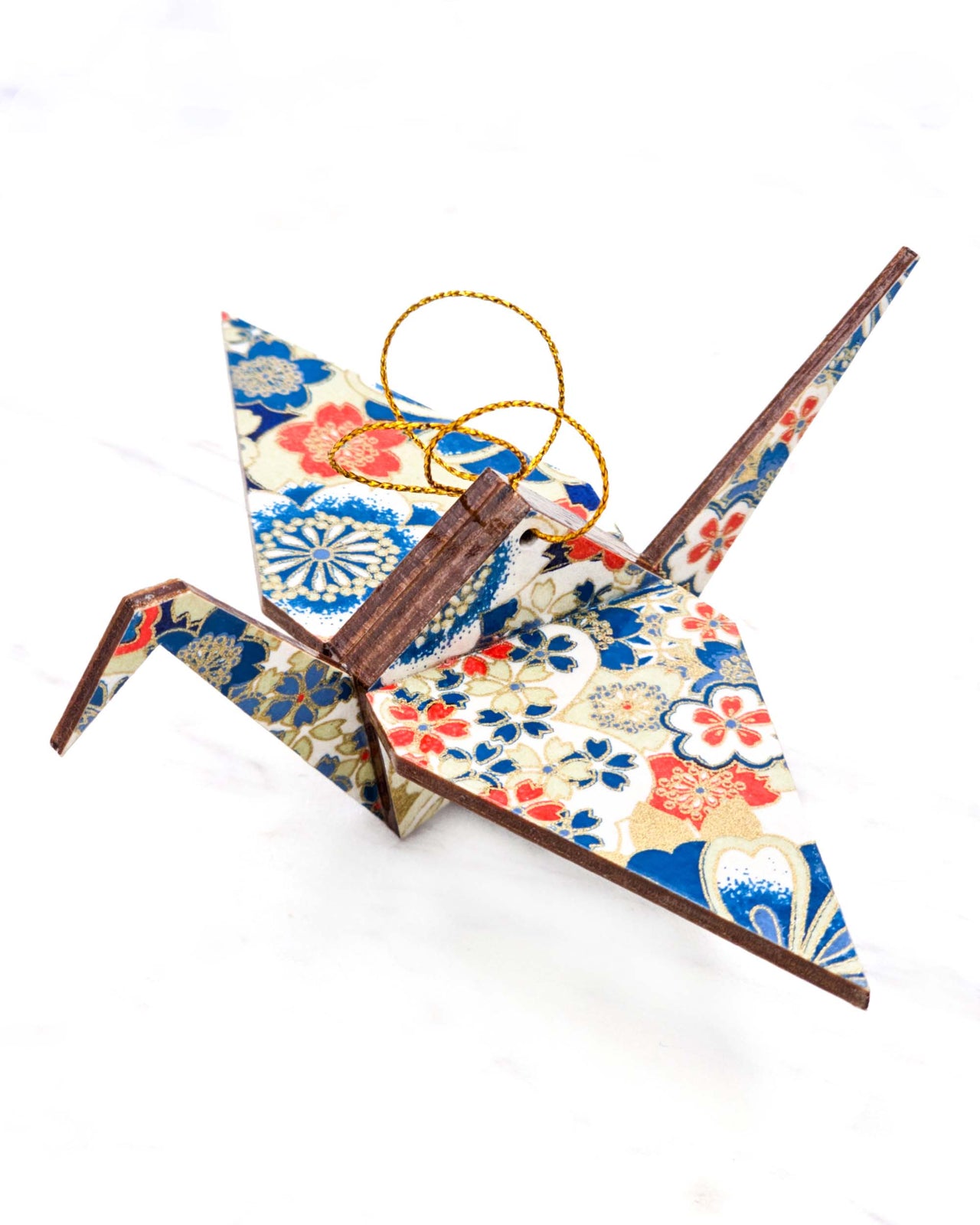 Large wooden origami crane ornament featuring red, white, and blue cherry blossoms with metallic gold details.