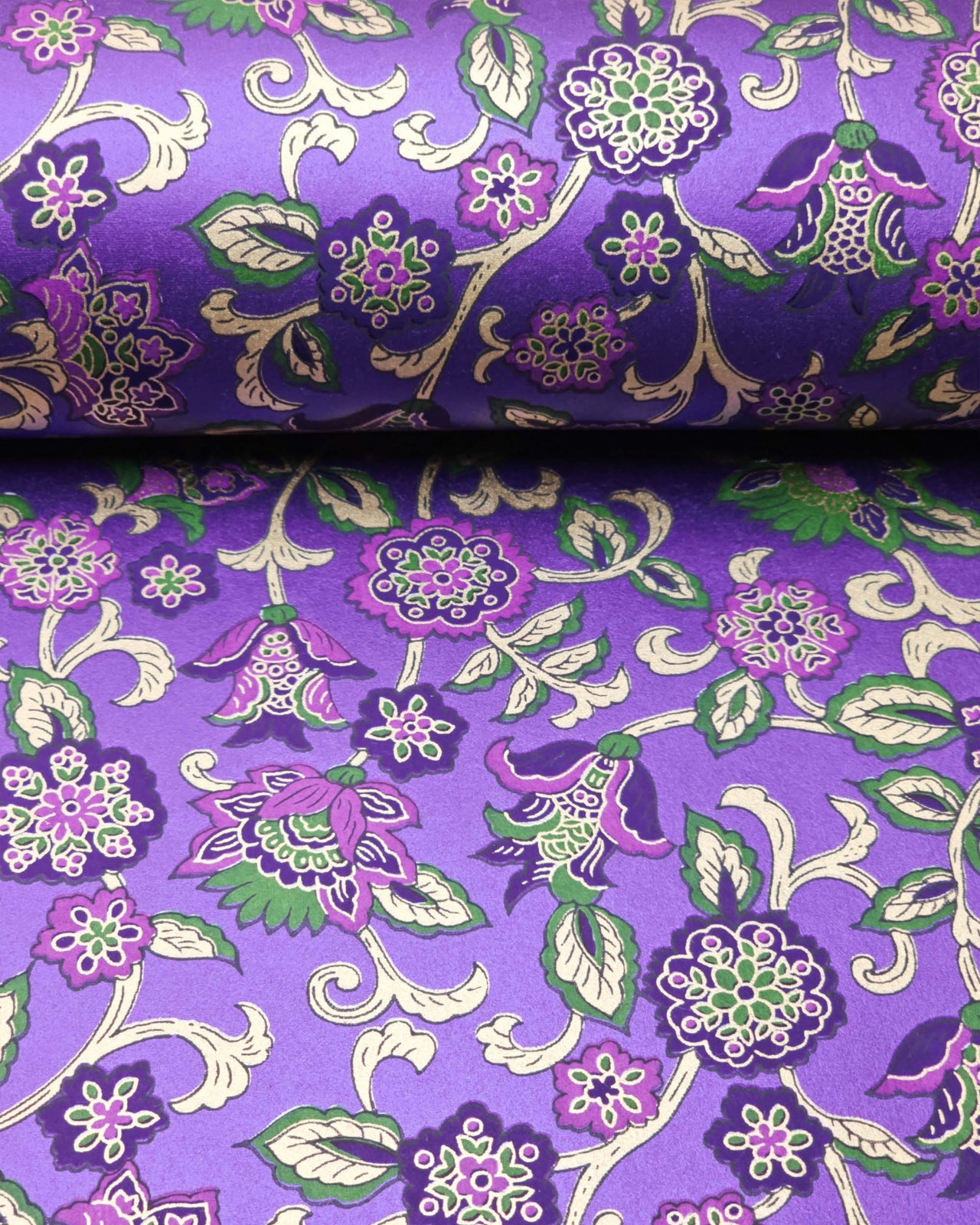 Japanese chiyogami featuring green & purple sarasa flowers on a pearlescent purple background with metallic gold accents.