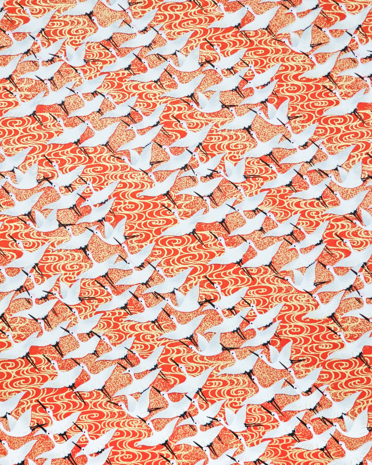 Japanese chiyogami paper featuring white flying cranes on an red background with metallic gold accents.
