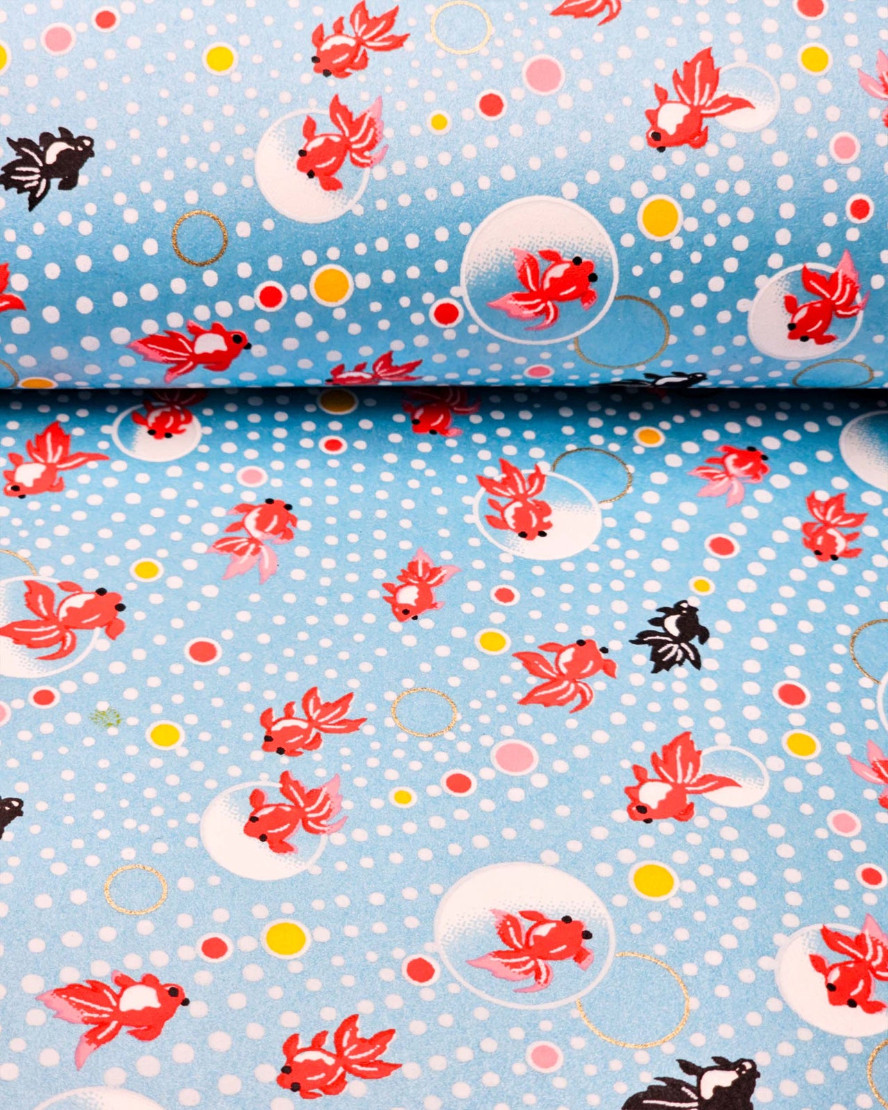 Japanese chiyogami paper featuring red and black fishes on a pearlescent blue background with metallic gold accents