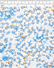 Japanese chiyogami paper featuring blue and white cherry blossoms on a blue background with metallic gold accents