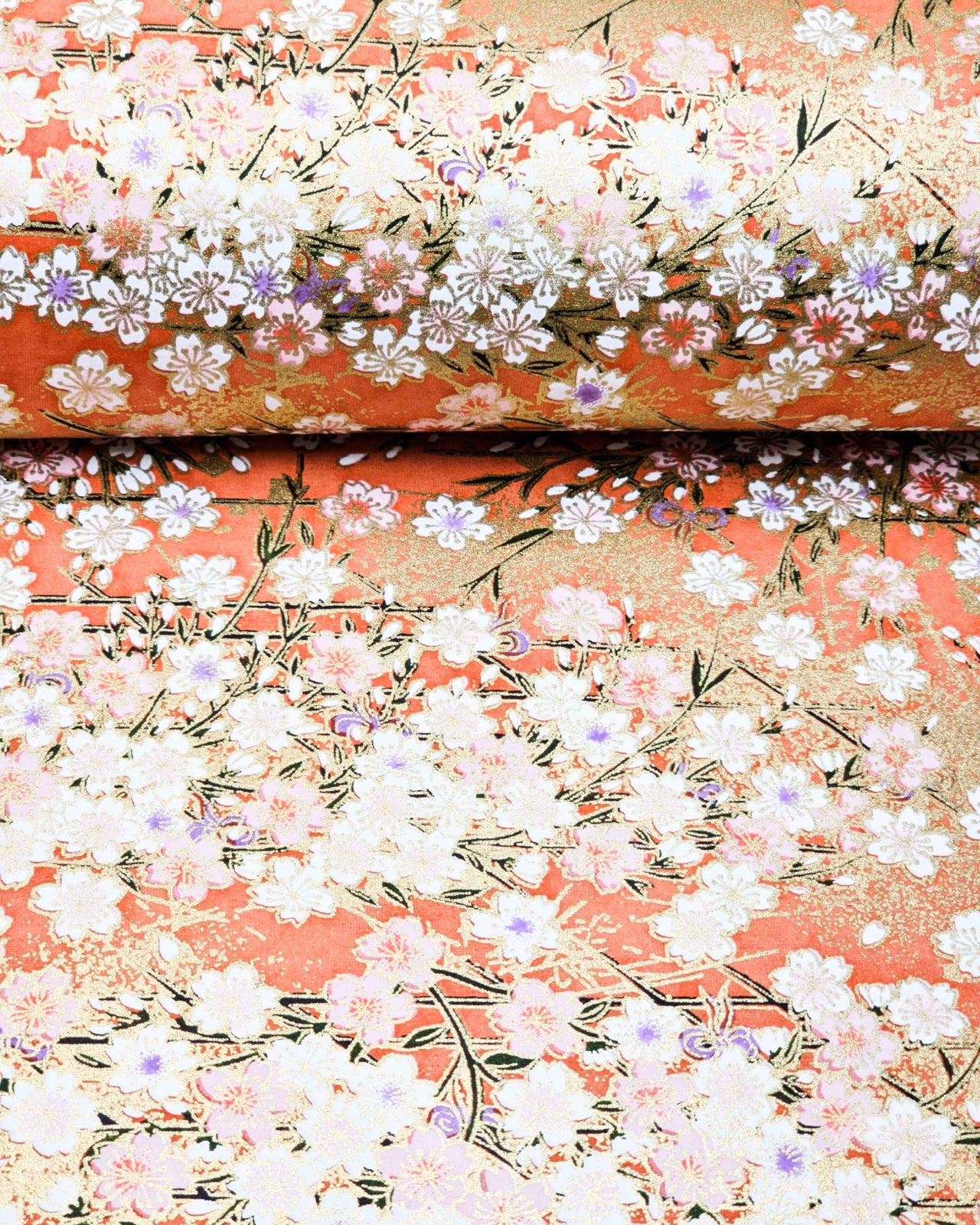 Japanese chiyogami paper featuring white and pink cherry blossoms on a reddish orange background with metallic gold accents