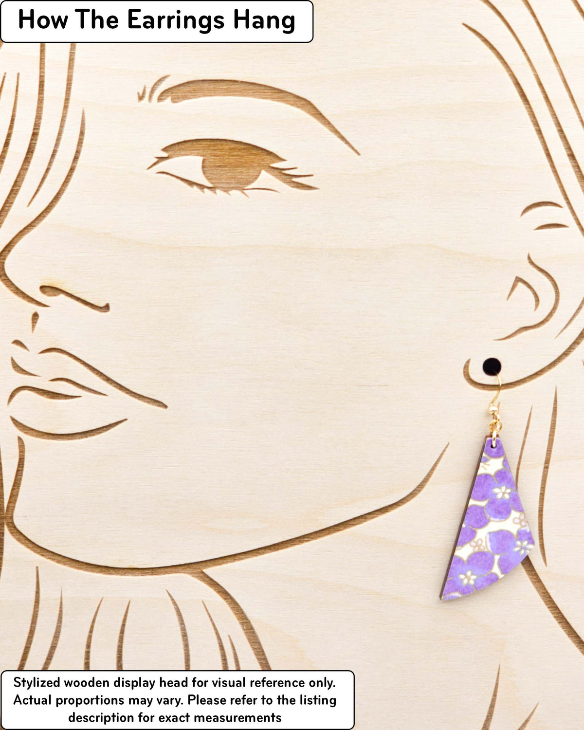 Medium wooden flared drop shaped earrings featuring purple cherry blossoms on a cream background metallic gold details.