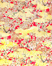 Japanese chiyogami featuring white plum blossom branches on a red and gold background with metallic gold accents.