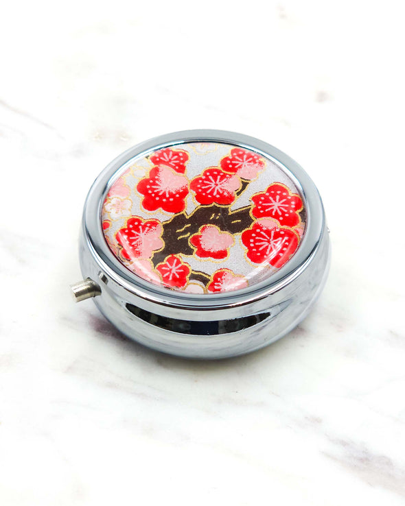 Red Plum Blossoms on Silver Pill Box