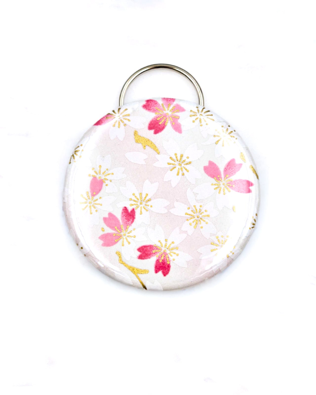 Magnetic bottle opener featuring pink and white cherry blossoms on a white background with metallic gold accents.