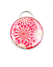 Magnetic bottle opener featuring pink and white abstract parasols with metallic gold accents
