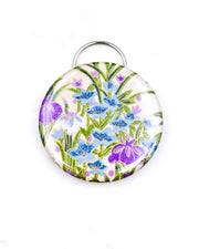 Magnetic bottle opener featuring purple and blue iris flowers on a cream background with metallic gold accents.