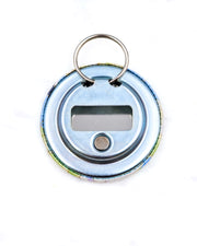 Magnetic bottle opener featuring purple, blue, and green pansies with metallic gold accents.