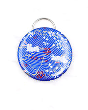 Magnetic bottle opener featuring white rabbits and cherry blossoms on a blue wave background with metallic gold accents.