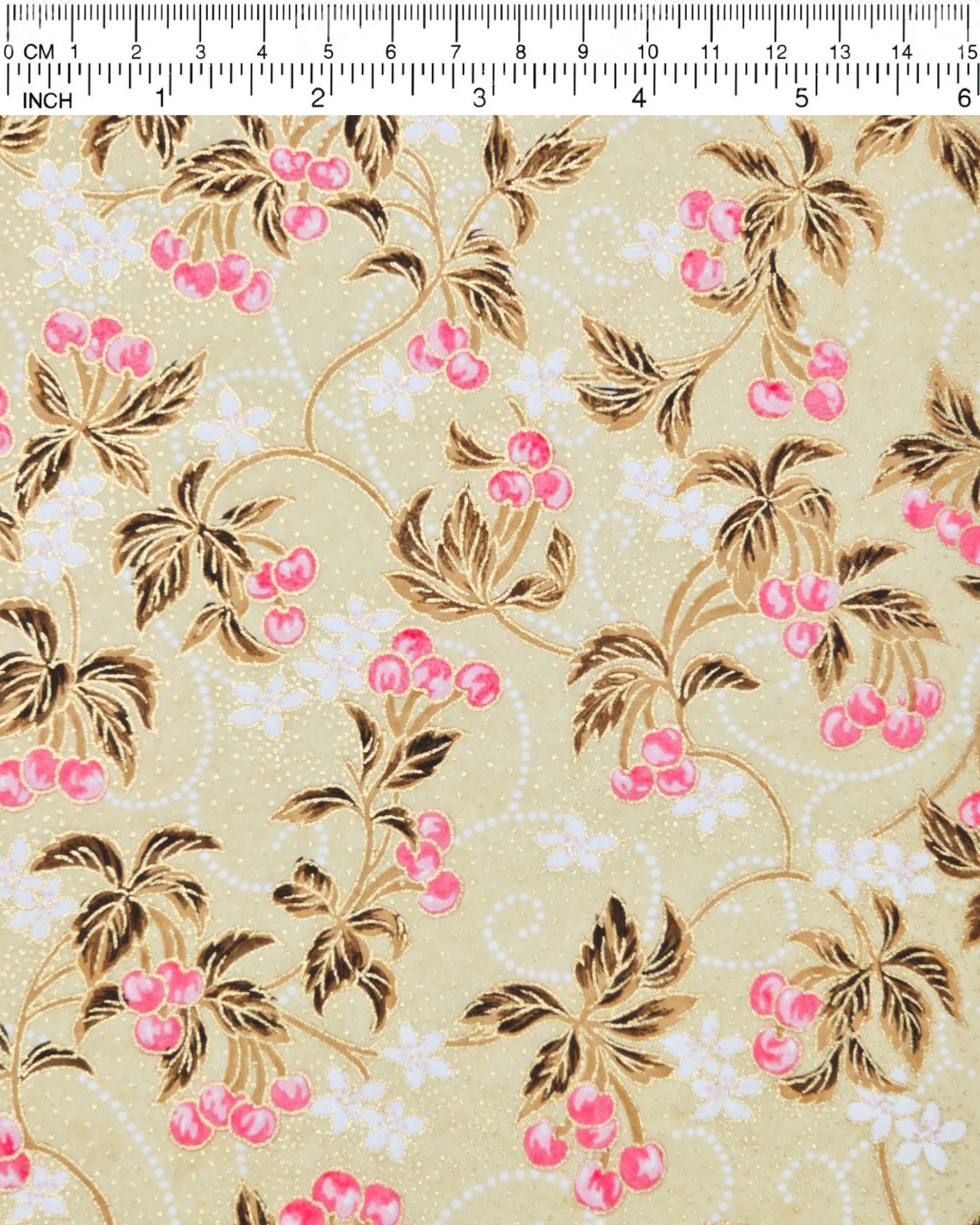 Japanese chiyogami paper featuring clusters of pink cherry fruit with white flowers and brown leaves on a beige background with metallic gold details.