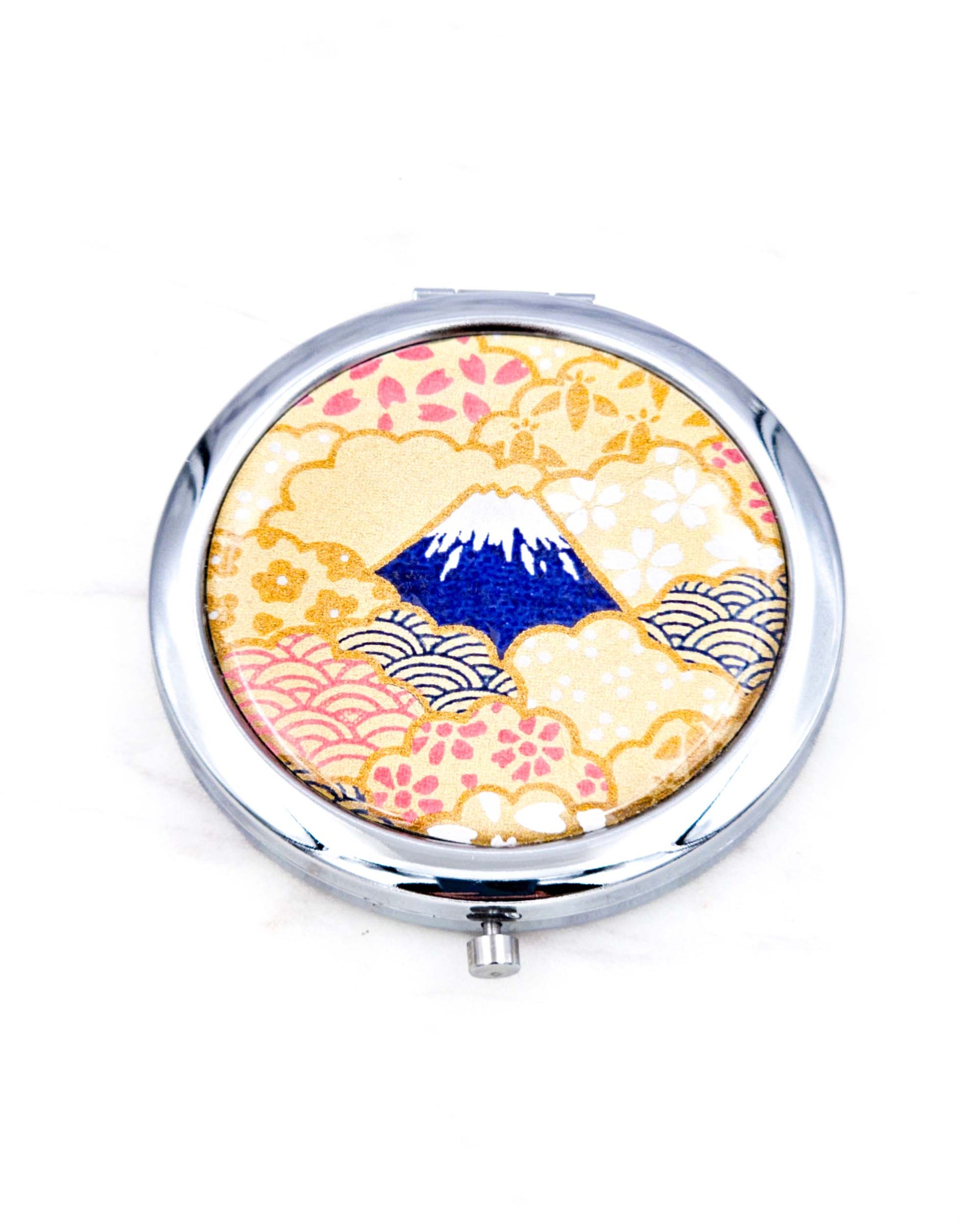 Silver metal compact mirror featuring a blue Mount Fuji on a metallic gold background.