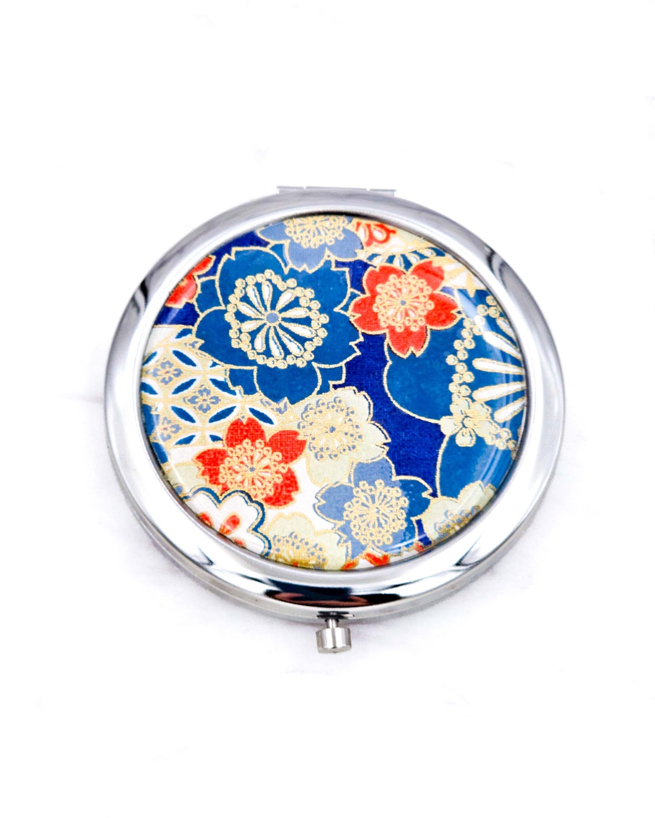 Silver metal compact mirror featuring red, white, and blue cherry blossoms with metallic gold accents.