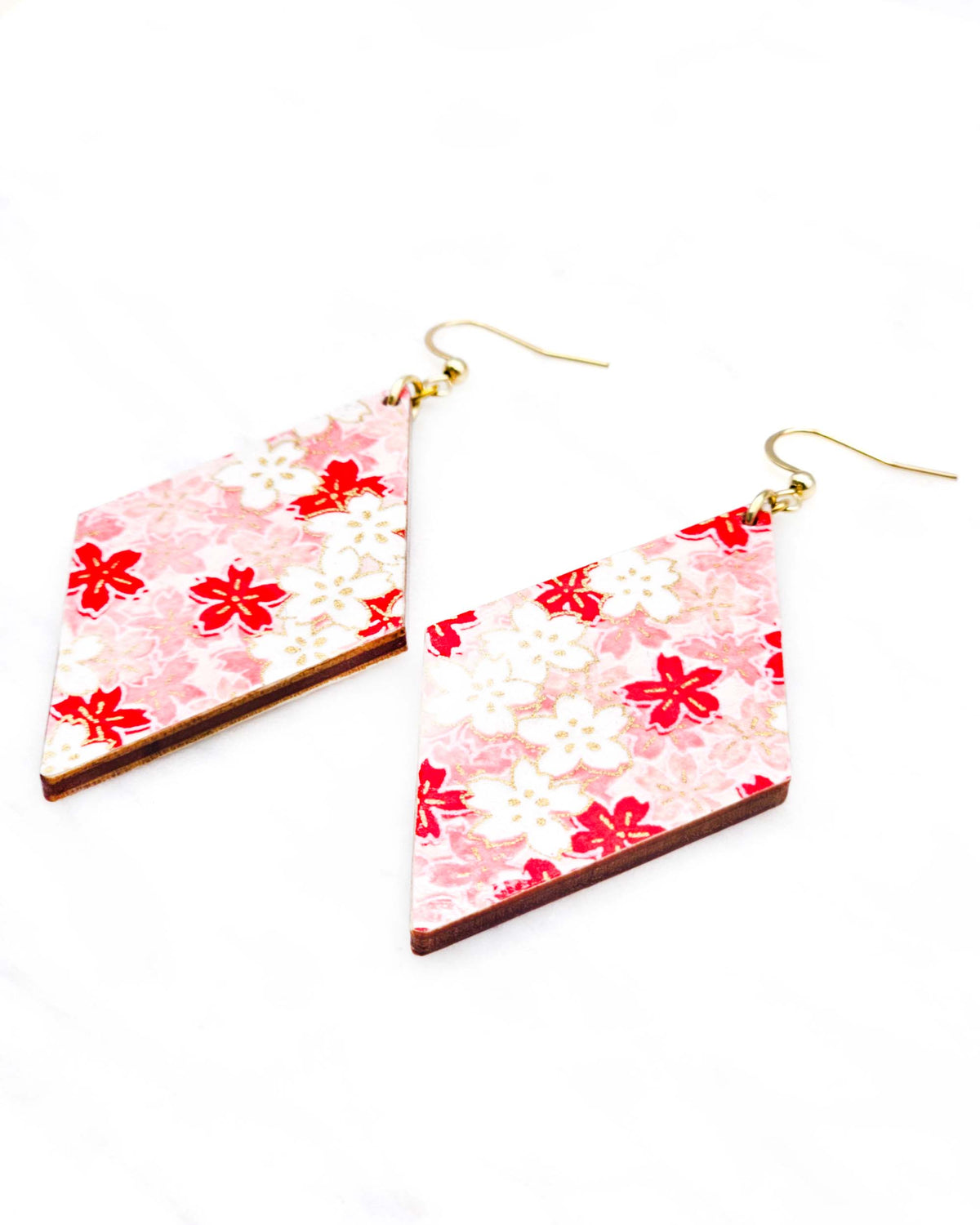 Large wooden diamond shaped earrings featuring pink and white cherry blossoms with metallic gold details