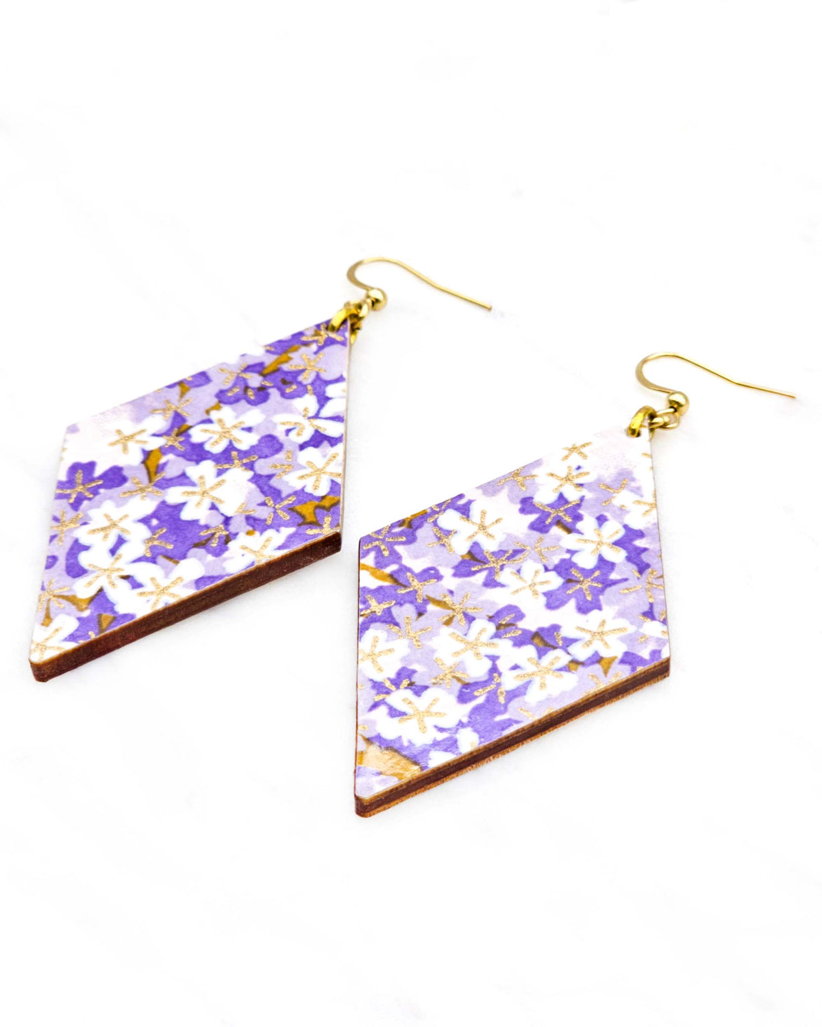 Large wooden diamond shaped earrings featuring purple and white cherry blossoms with metallic gold details