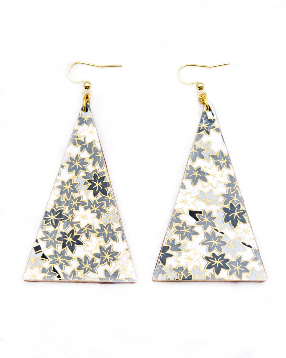 Large wooden long triangle shaped earrings featuring small gray and white momiji (maple leaves) on a light gray background with metallic gold details.