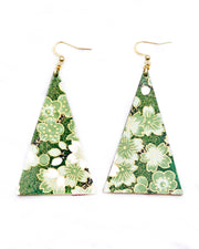 Large wooden long triangle shaped earrings featuring green and white cherry and plum blossoms with black branches on a green background with metallic gold details.