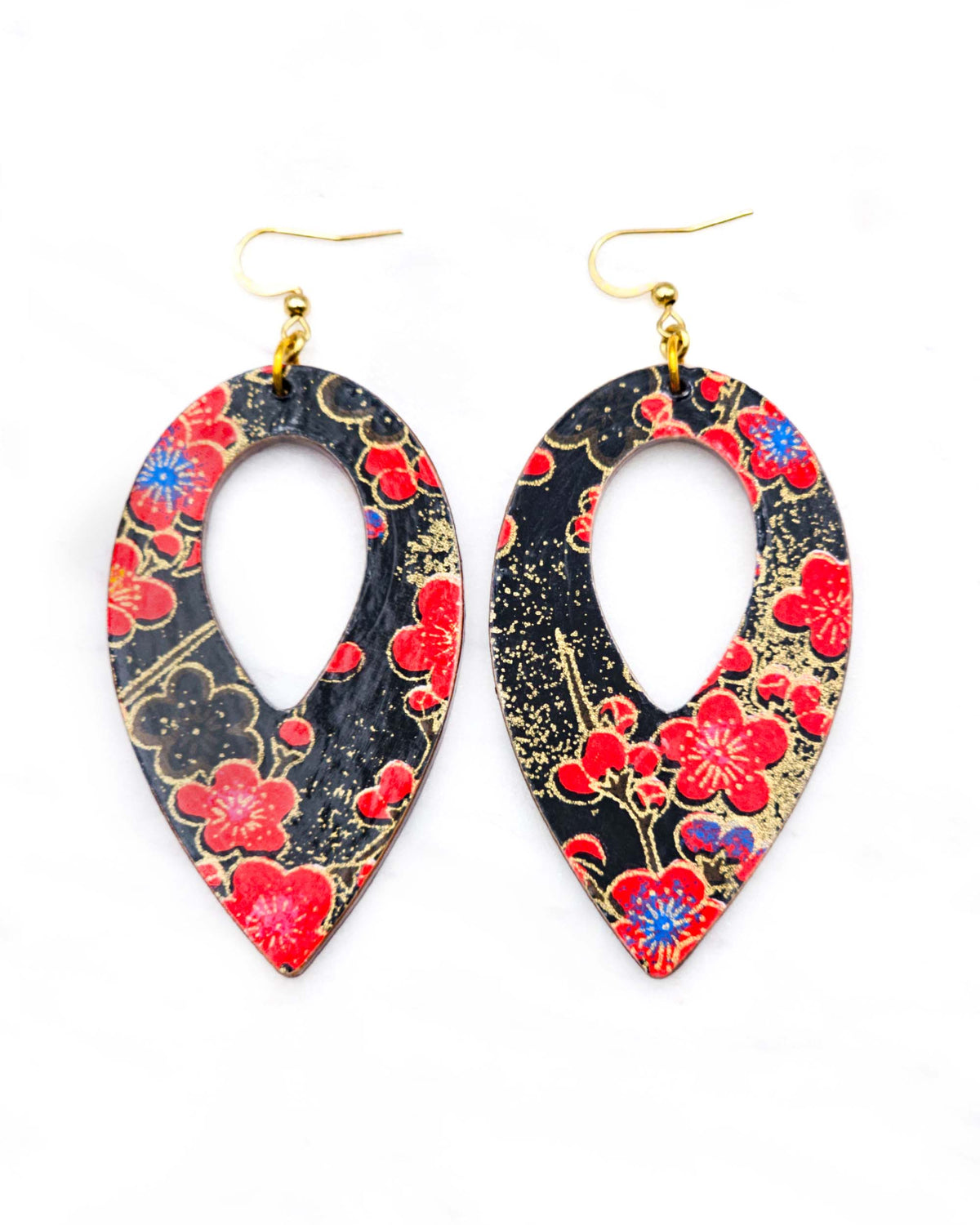 Large wooden hollow reverse teardrop earrings featuring red plum blossoms with a little bit of blue on a black background with metallic gold details