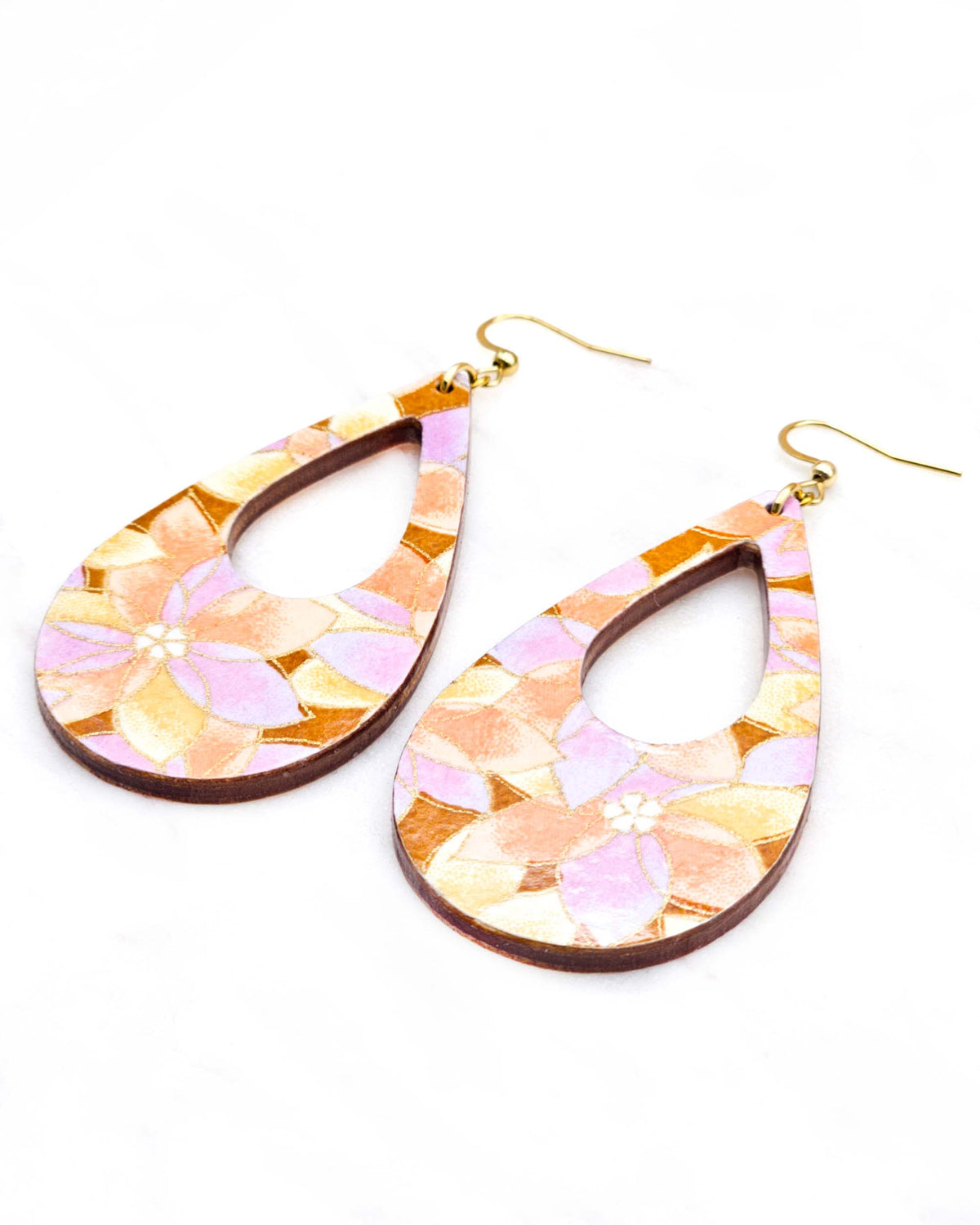 Large wooden hollow teardrop earrings featuring orange, brown, and light purple lotuses on a brown background with metallic gold details.