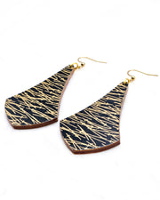 Large wooden long anchor earrings featuring metallic gold matsuba (pine needles) on a black background,
