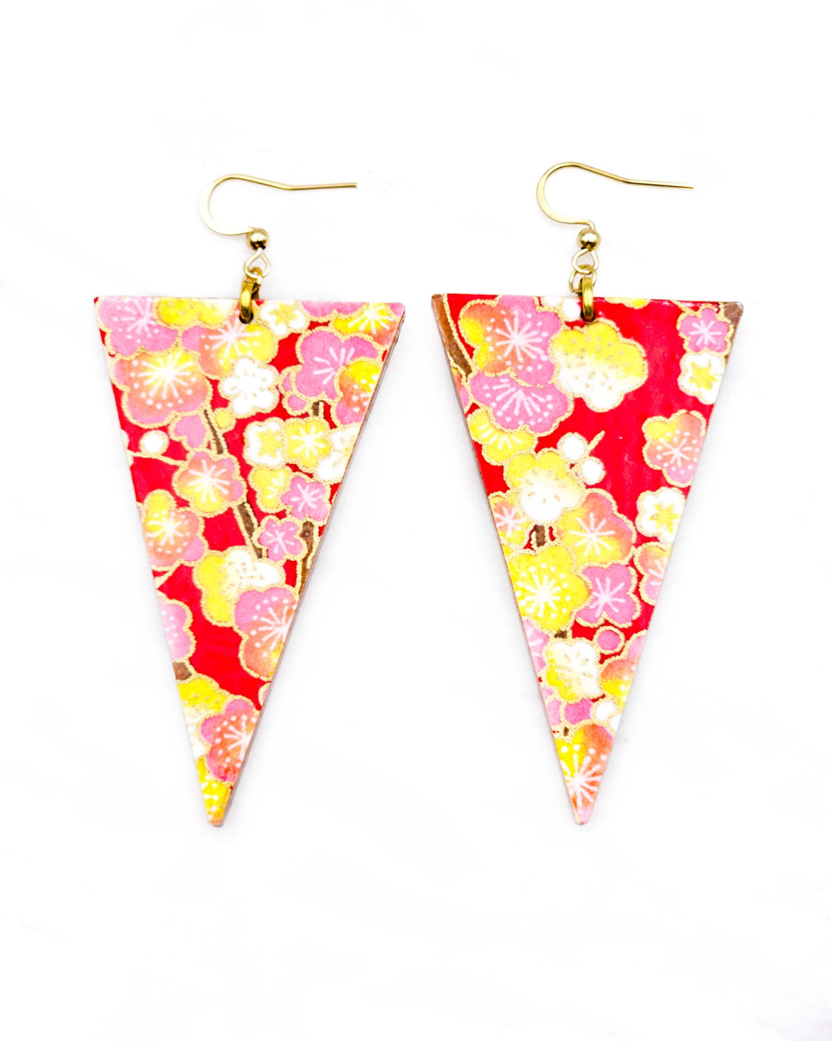 Large wooden long triangle shaped earrings featuring pink, yellow, and white plum blossom trees with brown branches on a red background with metallic gold details.