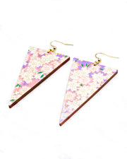 Large wooden long triangle shaped earrings featuring pink and white cherry blossoms on a pearlescent light purple background with metallic gold details.