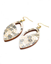Medium wooden cutout pointed oval shaped earrings featuring small gray and white momiji (maple leaves) on a light gray background with metallic gold details.